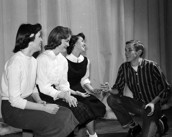 Three laughing "French dancers" pose and look towards John Miller (Simon O'Hara), right. The dancers are, Barbara Newton, Jackie Plenke, and Joanne Lillywhite.