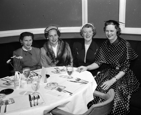 Three retiring officers of the Women's Bowling Association seated at the annual spring luncheon. From left are: Mrs. Alice Fess, newly elected president; Mrs. Margaret Curtis, secretary; Mrs. Marion Lange, vice-president; and Mrs. Delores Peck, president.