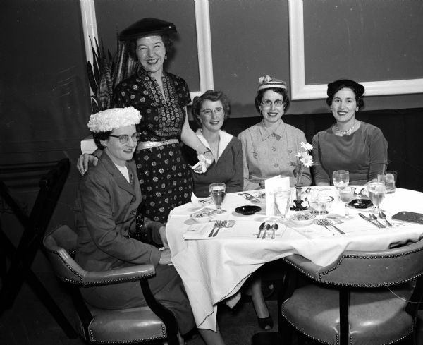 Mrs. Bonnie Kotz, newly elected treasurer of the Women's Bowling Association, standing behind members of the season's winning team at the annual spring luncheon. Team members, sitting left to right, are Mrs. Lorraine Rieman, Mrs. Robert E. Lenhard, Mrs. Connie Schwoegler, and Mrs. Mary Amato.