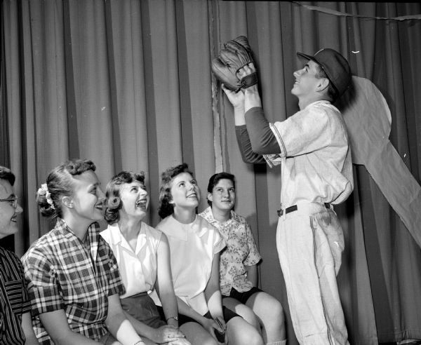 Don Acker, a Middleton High School baseball player, is shown with student fashion models in their self-made clothes. They include, from left, Marilyn Miller, Mary Gay Nietzke, Linda Licklider, and Sharon Schwarz.