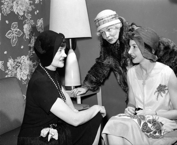 The 30th anniversary of the village of Shorewood Hills was celebrated by the women of the community at a costume luncheon at the Blackhawk Country Club. Garbed in costumes of the flapper era are Betty Geisler, Rea Ragatz, and Marie Johnson.