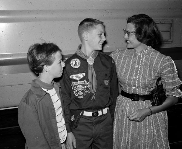 Boy Scout Jim Drescher says good-by to his sister Becky Drescher and his mother, Marcine Drescher, at the railroad station before leaving for the Jamboree.