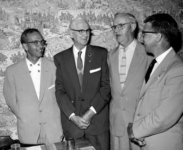 Four men attend the installation of Madison Optimists officers. They are, from left to right, Wesley West, lieutenant governor of the Madison area; Melvin C. Reppen, past international director; Stan Nicols, past lieutenant governor; and Charles F. Du Bois, past president. 
