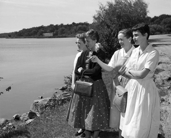 A tour guide shows new St. Mary's Hospital School of Nursing students around Madison. Viewing Vilas Park and Lake Wingra are, left to right: Sheila Deseve, Beloit; Virginia Coleman, Wauwatosa; Mary Kretschman, a member of St. Mary's hospital auxilary; and Sharon McGucken, Milwaukee.