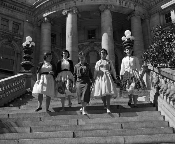 Descending the steps from the Wisconsin State Capitol building are five new St. Mary's Hospital School of Nursing students on a tour of Madison. Left to right, Susan Byrne, Glenview, Illinois; Colleen Fahey, Madison; Mary Patricia Friar, Boscobel, Gloria Staskal, Boscobel; and Yvonne Timm, Kohler.