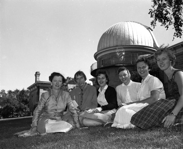 A tour guide and five new St. Mary's Hospital School of Nursing students sitting on Observatory Hill during a tour of Madison. Left to right, Marie Frost, St. Mary's hospital auxiliary member and tour guide; Dorothy Ginter, Westfield; Patricia Gorychka, Beloit; Barbara Etter, Argyle; Mary Meyers, Watertown; and Janet Dittmann, Watertown.