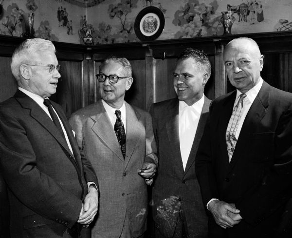 Superior Judge Roy H. Proctor (left), Herman Wittwer, Bob McDermott, and Bill Whalen attend a birthday party for Joseph (Roundy) Couglin at the Top Hat. Roundy was a popular sports columnist for the <i>Wisconsin State Journal</i>.