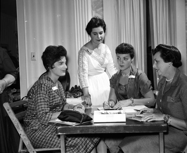 Officers of the Madison section of the Council of Jewish Women attending a tea. They include, from left, Jeanne Silverberg, financial secretary; Nadine Shapiro, publicity chairman; Mazadai Frank, treasurer, and Edith Hopkins, recording secretary.