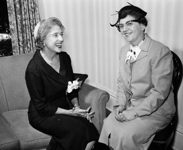 Mrs. Louis A. Pollock of Denver, Colorado represented the national board of the Council of Jewish Women while a guest at a tea put on by the Madison section. She is sitting with Elsie Kravat, president of the Madison section.
