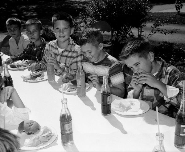 The Zimmerman twins, Lettie and Lloyd, celebrated their 11th birthday with 54 friends and 12 teachers at Lincoln School. From left to right are friends: Lyle Crary, Darwin Thompson, Timothy Heggland, and Carter Dary.