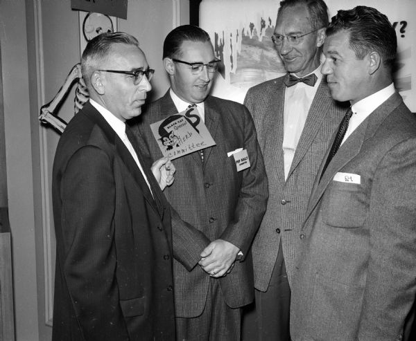 Shown at the 8 a.m. rally at the Orpheum Theatre are, from left, Harry McGuire, Wolff Kubly and Hirsig, rally chairman; Herbert Martin, J. C. Penney Co., co-chairman; John Scharenberg, manager of the Strand theater; and Francis Hoffman, one of the speakers at the rally.