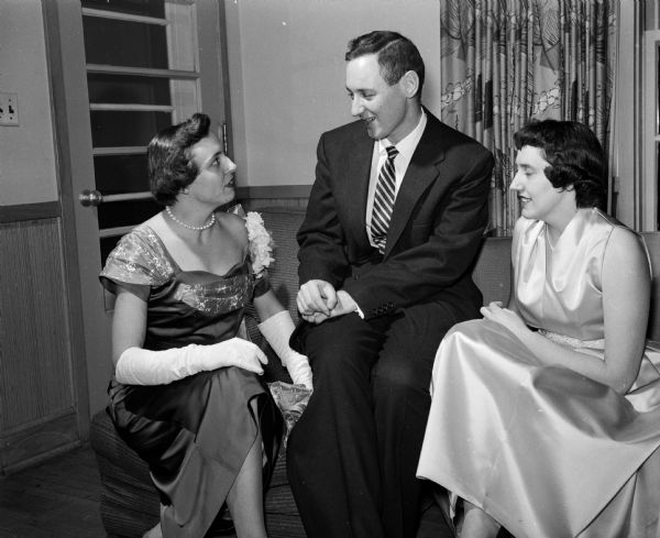 Shown chatting are Delores and Dr. A.V. Kanner, and Irma Taylor. Mrs. Kanner was chairman of the dance committee.