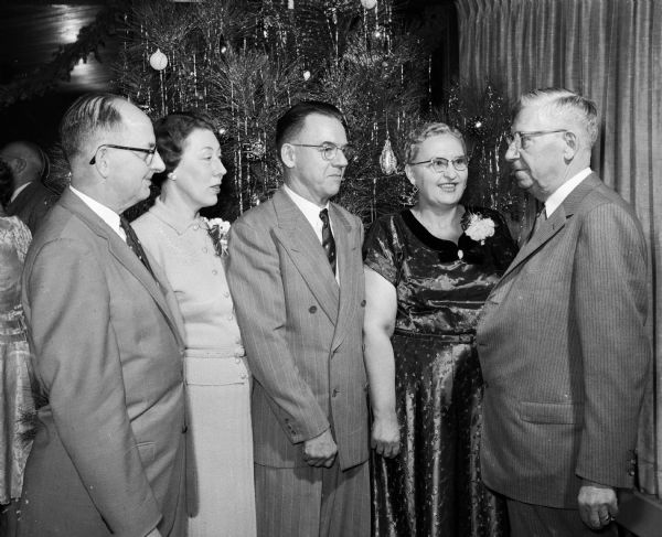 Attendees at the Hult Capital Garage "family" party, held at Nakoma Country Club include garage president Ralph Hult at far left. Others are, from left to right: Ben and Ethel Drake; George and Lucille Grover.
