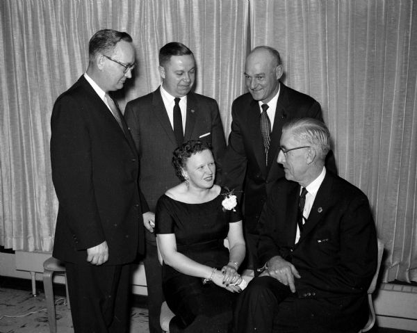 Attendees at a party for the Hult Capital Garage "family" party. Seated are Elizabeth and William Garrity. Standing left to right: Clarence Thorstad, Winston Smith and Howard Oren.