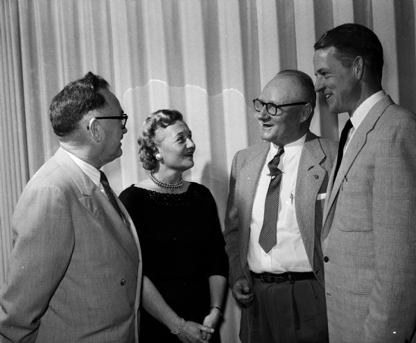 Four attendees of the Dane County Republican club's "Tewsday" party
include, from left to right: E.G. Ascher, Stoughton; Constance Holmquist; 2nd district Republican vice-chairman; Floyd R. Wagener and Robert Daley, Mr. Horeb. The party is in honor of Rep. Donald E. Tews, Waukesha.