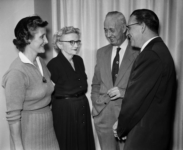 Janet Pond (left) and Teresa Dexter stand beside their husbands, James Dexter and Gill Pond. They are possibly members from Colvin Baking Co., a firm asscciated with the Gardner Company.