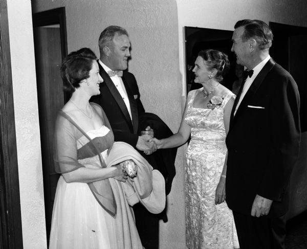Members of Nakoma Golf Club attend the New Year's Eve "Sno-Ball" dinner dance. They include, left to right: Ruth and William Garrott and A.F. and Emily Ahearn.