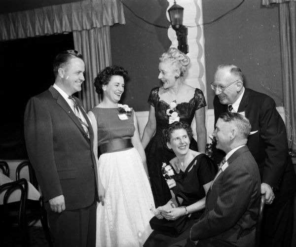 Attending a dinner dance for members of the Dane County Bar Association and their wives are, standing from left to right: Elenor Bjork, Louise Brown, and Charles Goldberg, Milwaukee, president-elect of the Wisconsin Bar Association. Seated are Mrs. Charles Goldberg and Justice Timothy Brown of the Wisconsin Supreme Court.
