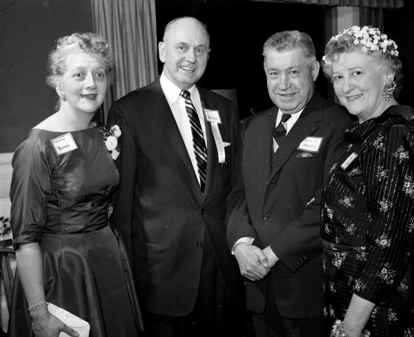 Present at a dinner dance for members of the Dane County Bar Association and their wives are, left to right: Christine and Lyall Beggs, and Chief Justice John E. and Mary Martin.