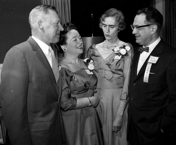 Present at a dinner dance for members of the Dane County Bar Association and their wives are, left to right: John Esch, Dorothy Sinykin, Dorothy Esch, and Gordon Sinykin.
