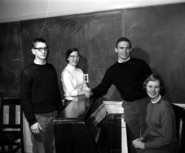 Wisconsin High School students rehearse for a musical program for World Day of Prayer. They include, from left to right: Oz Marshall, Karen Isaksen, Ted Groves, Helaine Muehlmeier.