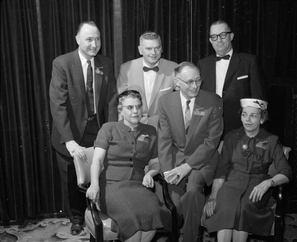 In attendance at the Wisconsin Motor Vehicle Department Banquet are (seated in the first row): Ethel Connors, H L. Stone, and Marie Howard. Standing in back are: Glen Kissinger (of the state traffic patrol), banquet master of ceremonies, State Patrol Capt. James Karns, and L.E. Beier (director of enforcement).