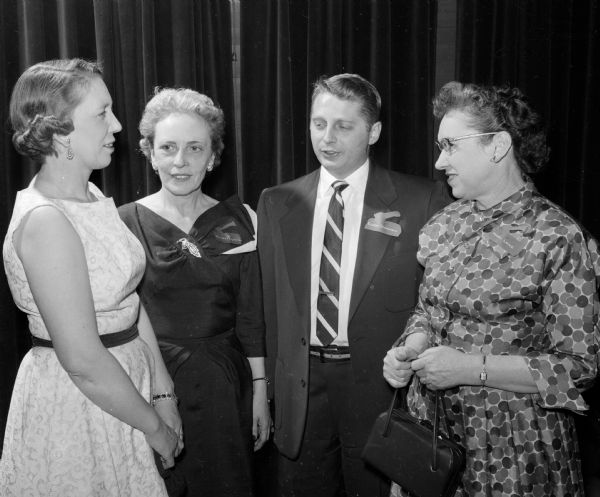 Gwen Hendricks, Vivian Reynolds, Eldon Schimming, and Hazel Lenz chat at the Wisconsin Motor Vehicle Department Banquet.