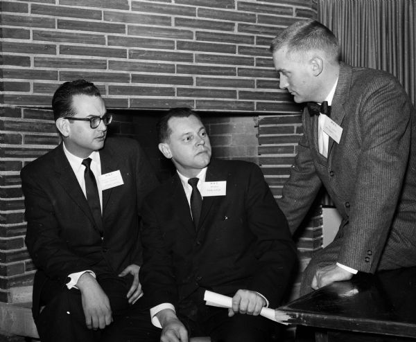 Shown are Jack Stephan, left, and Thomas Towell, right, who both run their own ad agencies. In the center is Frank Hepland, main speaker at the event, and a member of the Gardner Co. of St. Louis.