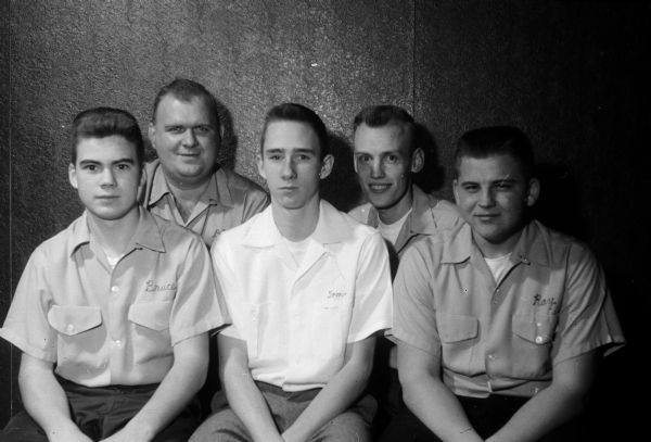 Group portrait of Homer's Liquor Store's "up-and-coming" young bowling team in Madison. Front row left to right: Bruce Felland, Tom Middleton, Ray Cass. Back row: Dick Rogers and Al Byom.