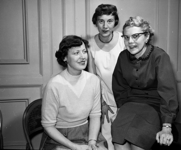Members of the Philharmonic Chorus hold a reception in Esther Hall of the YWCA.  Three members of the reception social committee include, from left to right, Ruth Foster, Barbara Fauerbach, and Ruth Mackie.