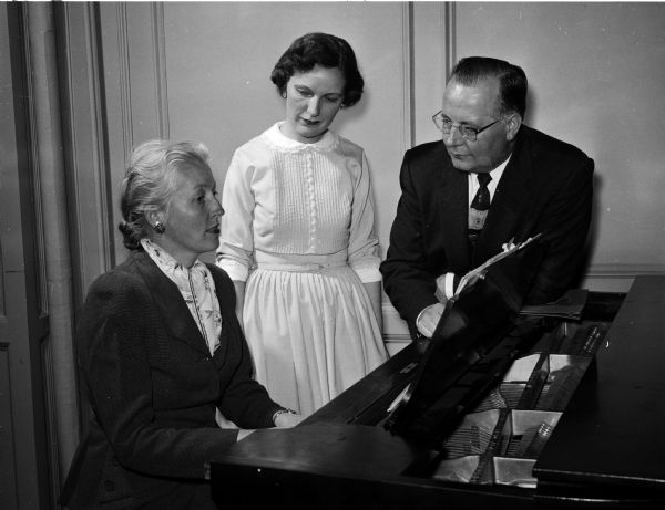 Members of the Philharmonic Chorus hold a reception in Esther Hall of the YWCA.  Left to right are Mrs. Ambrose Landmark, accompanist; Ruth Dickert, president; and Bernhardt Westlund, director.