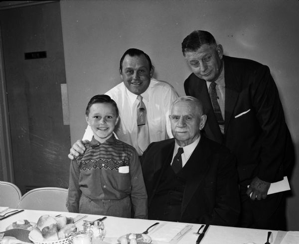 Four generations of one Madison family attend a father-son banquet at Immanuel Lutheran Church. Front row, left to right: Robert Blawusch and his great grandfather, Gottlieb Blawusch. Standing is Robert C. Blawusch, left, Bobby's father, and his grandfather, Arthur Blawusch.