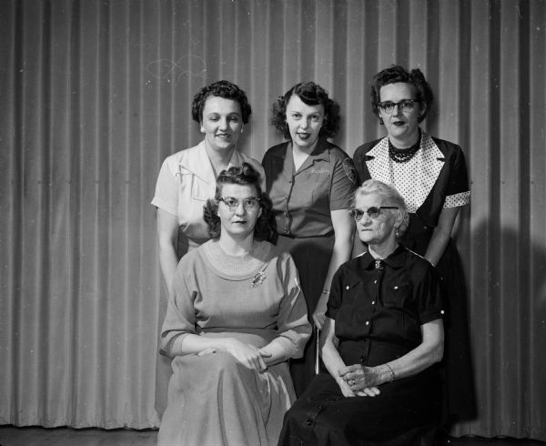 One of Madison's three teams to compete at Milwaukee in the Eagles International Ladies handicap bowling tournament is an all-family team made up of mother, daughter, and three daughters-in-law.  In the front row are Laura Tucker, 68; and her daughter, Harriot Meister, 39. In the back row are her daughters-in law, Margaret Tucker, 43; Marion Tucker, 32; and Eva Tucker, 39.