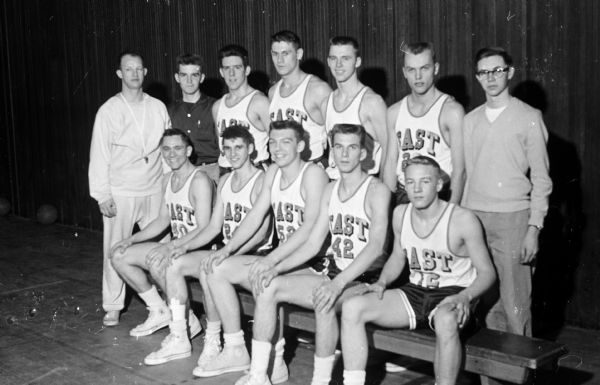 Group portrait of Madison East High School basketball team.
