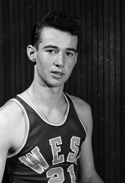Portrait of one individual on the Madison West High School basketball team.