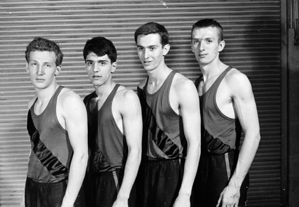 Kenosha High School's champion mile relay team came within two-tenths of a second of the meet record set by Madison West High School in 1950. They include, from left to right: Eugene Decker, Ron Pellegrine, John Huxhold, and Don Halager.