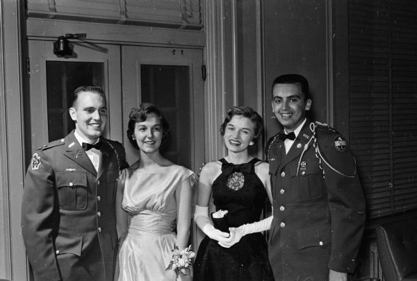 Attending the University of Wisconsin military ball, sponsored by the three ROTC branches of service at the university are, left to right: Howard Branton, Wilmette, IL, publicity and program chairman; Judy Curry, Evanston IL; Jane Jackson, Viroqua; and Dick Neuheisel, Milwaukee, vice-chairman of the Military Board.