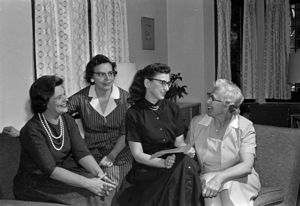 A committee is making plans for a Madison League of Women Voters Tea at the Governor's Mansion. Members of the committee are, from left to right: Joanne Clingman, Rosemary Westley, Alicia Ashman, and Olive Ihde.