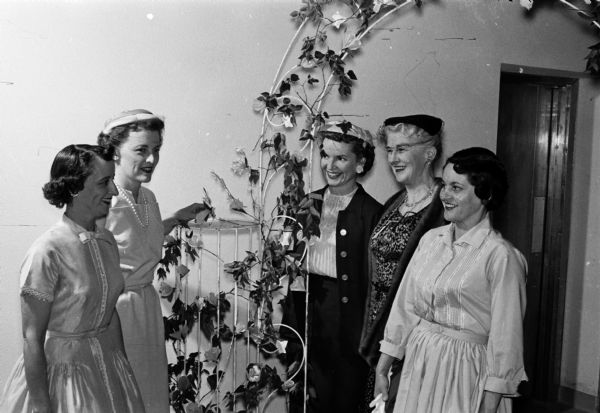 Mary Sparkman (left), Ann Vincent, Patricia Camp, Mrs. Paul L. Higley and Sena Kvitle attend the Westmorland Community Association Annual Party held in the auditorium of Our Lady Queen of Peace Church.