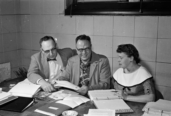 United Givers' committee members review an agency budget at a budget conference. They are, from left to right: Frank X. Davis, McFarland; Robert J. Nickles Jr. and Marion Leifer.