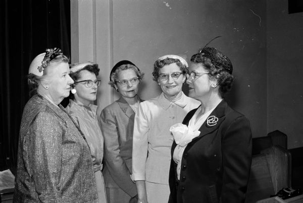 Group portrait of those attending the May Fellowship Day of the Madison Council of United Church Women at First Baptist Church. They include, from left to right: Dorothy Schar, First Evangelical United Brethren; Mrs Harold Schroeder, soloist; Marion Winans, First Methodist, guest organist; Loretta Norenberg, First Congregational; and Leona Stromberg, First Methodist.