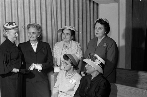 Attending the May Fellowship Day of the Madison Council of United Church Women at First Baptist Church and the churches they represent are, standing, left to right: Pearl Jennings, Glenwood Moravian; Olive Steinhauer, St. John's American Lutheran; Marion Orians, First Evangelical United Brethern and chair of May Fellowship Day; and Constance Elvejem, First Congregational. Seated are: Mrs. Richard Summers, Middleton Community and Gertrude Rellahan, Grace Episcopal.