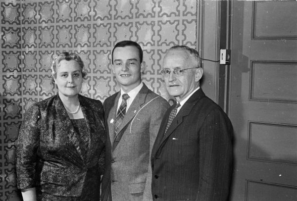 West High School student Jim Nafziger, center, is honored at an Elks banquet for outstanding high school youth. His parents, Mrs. and Mrs. Ralph D. Nafziger, are also in attendance.  
