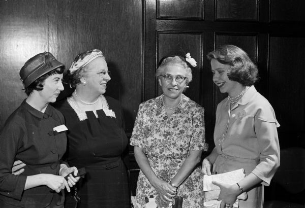 The annual breakfast of the University of Wisconsin Library School was held in Tripp Commons of the Memorial Union. Pictured, left to right, are Elien Malone, secretary-treasurer of the library class of 1958; Rachel Schenk, director of the University of Wisconsin Library school; Gladys Cavanagh, member of the library faculty; and Katrinka Van Wagenen, student decorations chairman of the breakfast.