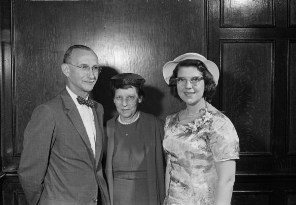 The annual breakfast of the University of Wisconsin Library school was held in Tripp Commons of the Memorial Union. Established in 1925, the breakfast serves as an annual reunion event for faculty, students, and alumni of the library school. Shown, left to right, are Herbert Sewell, library school faculty; Elizabeth Burr, children and young people's specialist with the Wisconsin Free Library Commission; and Mrs. Delores Brasch, member of the Madison Free Library staff.
