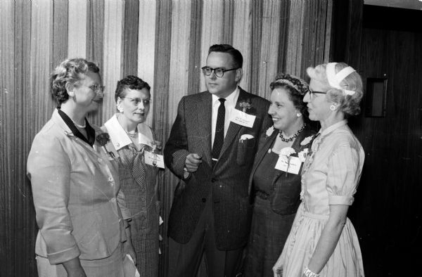 Wisconsin State Journal correspondents attend the annual correspondents' conference with John. R. Prindle, assistant state editor, center. The correspondents are, left to right: Marjorie Woods, Ontario; Mrs. Herbert Harris, Dodgeville; Mrs. W.J. Erlandson, Lake Mills; and Mrs. Elaine Grindell, Platteville.