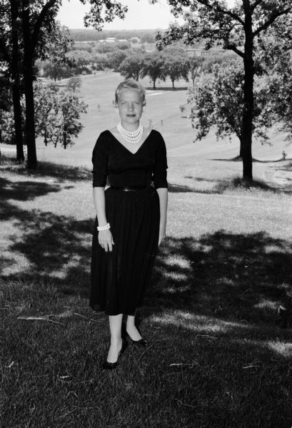 Portrait of Harriett Narowetz, who presides over women's activities at the Blackhawk Country Club. She is a mother of two small sons, and has also served as the choreographer for the Haresfoot Club at the University of Wisconsin for several years.