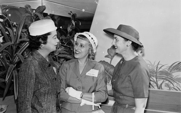 Many social events were planned for the wives who accompanied their husbands to a meeting at the Forest Products Research Society. Shown at a luncheon at the Edgewater Hotel are Mrs. W.J. Eason, wife of the president-elect of the society; Nancy Simeone, chairman of the women's program; and Helen Matheson, assistant managing editor of the <i>Wisconsin State Journal</i> who spoke at the luncheon.