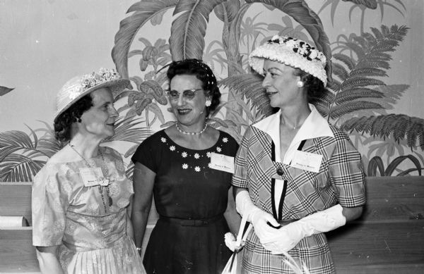 Many social events were planned for the wives who accompanied their husbands to a meeting at the Forest Products Research Society. Shown at the luncheon are, from left to right: Dorothy Fleischer and Irene Kimball, members of the women's committee for the conference, chatting with Mrs. Willard Irwin.