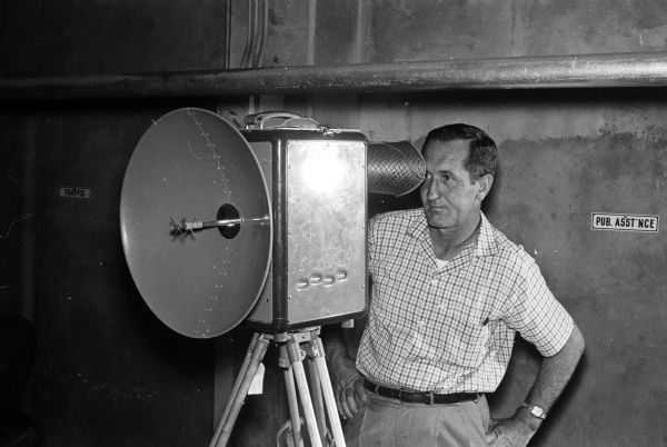 This is a Tellurometer, a microwave surveying instrument. The operator is Don Reed, field man for Alster and Associates, Washington, D.C., which completed a $440,000 aerial photography and mapping project for the city of Madison.